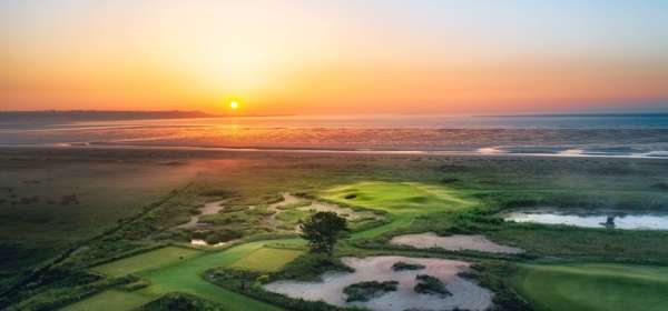 An aerial shot of Prince's golf course at sunset