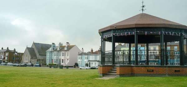 The bandstand on Walmer Green with buildings on The Strand in the background