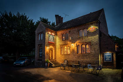 Exterior of Fitzwalter Arms lit up at night
