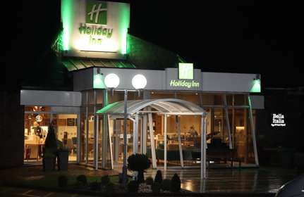 The exterior of the Holiday Inn Dover at night