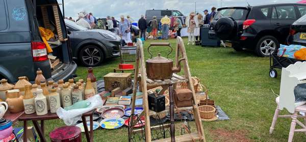 Shoppers at outdoor market stalls at Walmer Brocante in Deal
