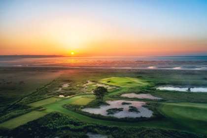 An aerial shot of Prince's golf course at sunset