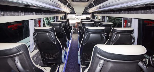 Inside of a minibus looking towards the front.