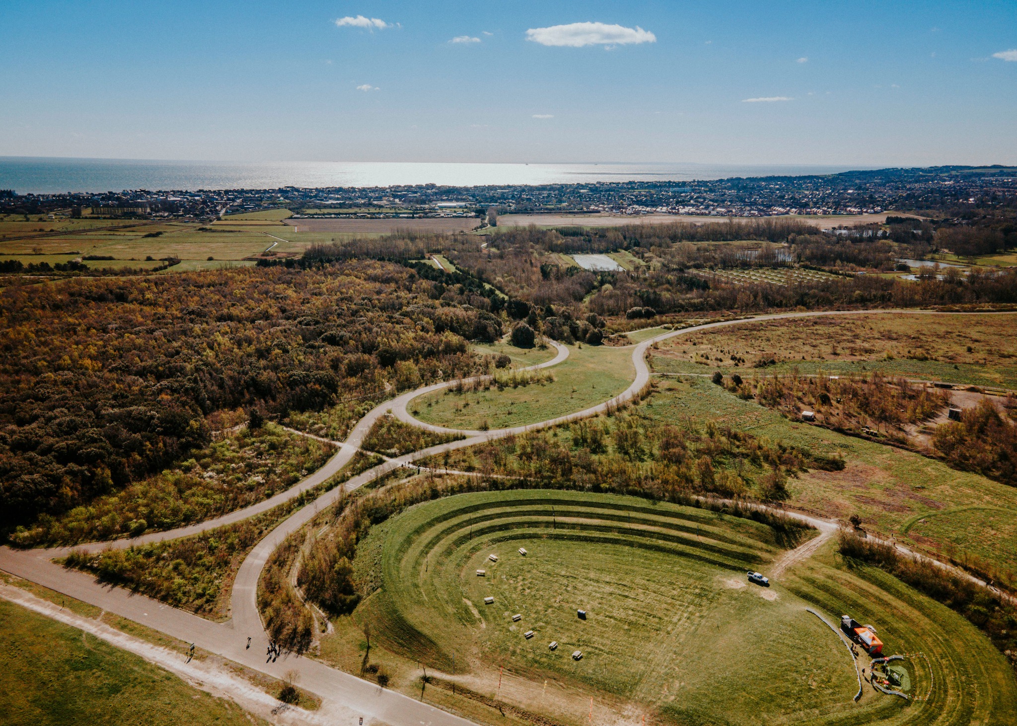 Aerial view of Betteshanger Park showing woodland and paths.