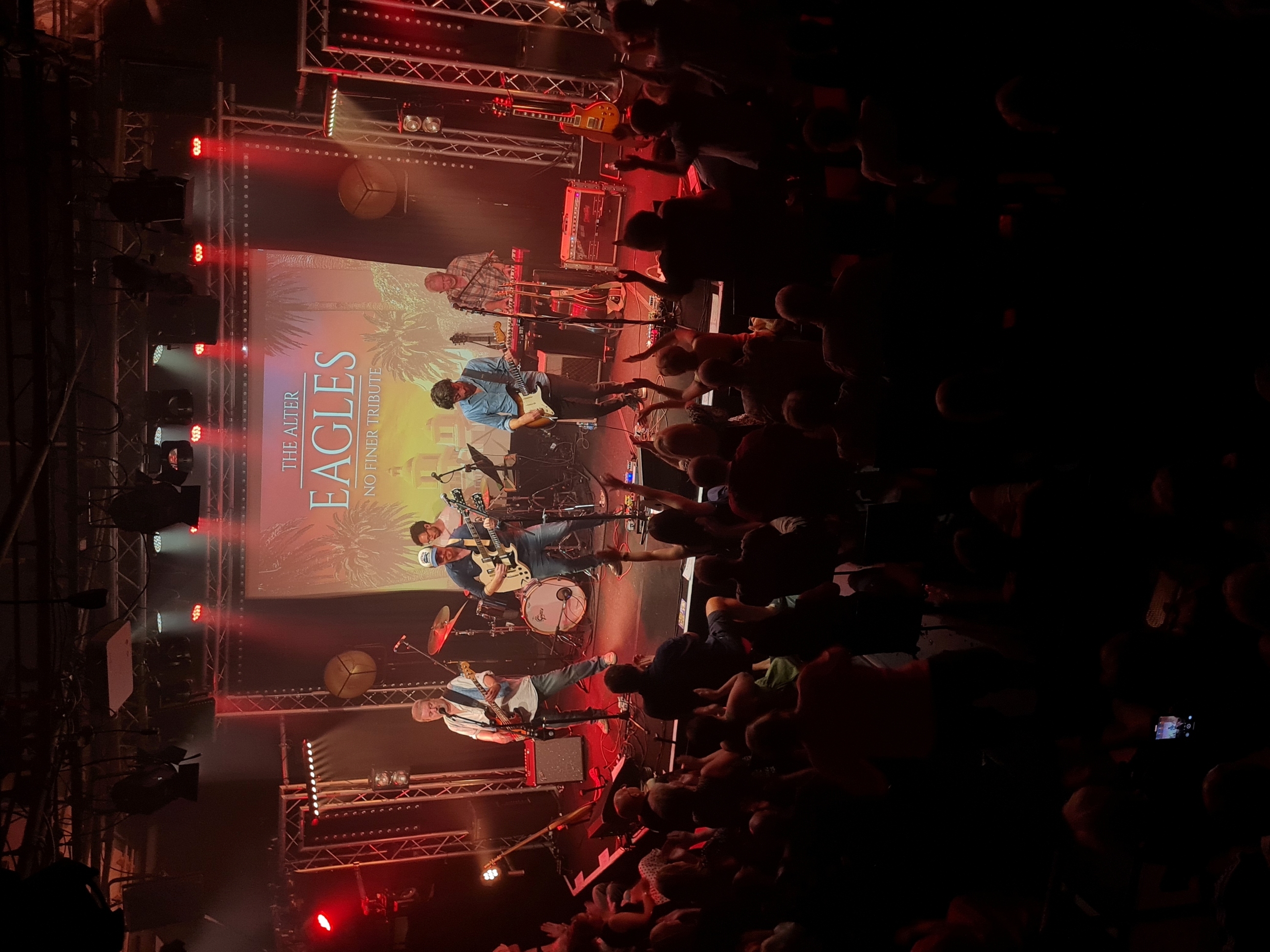 Band members on stage performing