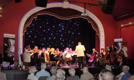 Image of the Palm Court Orchestra on stage at the Astor Theatre
