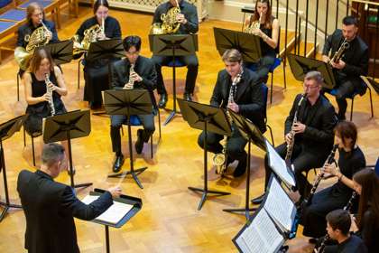 The conductor conducting the Royal Academy of Music Bassoon Ensemble