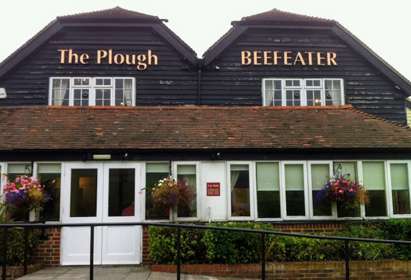Exterior of The Plough Beefeater with sloped access to double doors