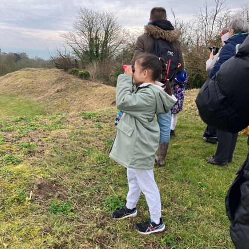 Child holding binoculars 