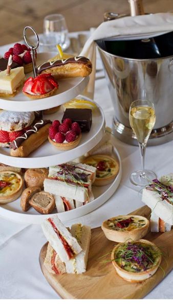 A 3 tier afternoon tea selection with champagne 