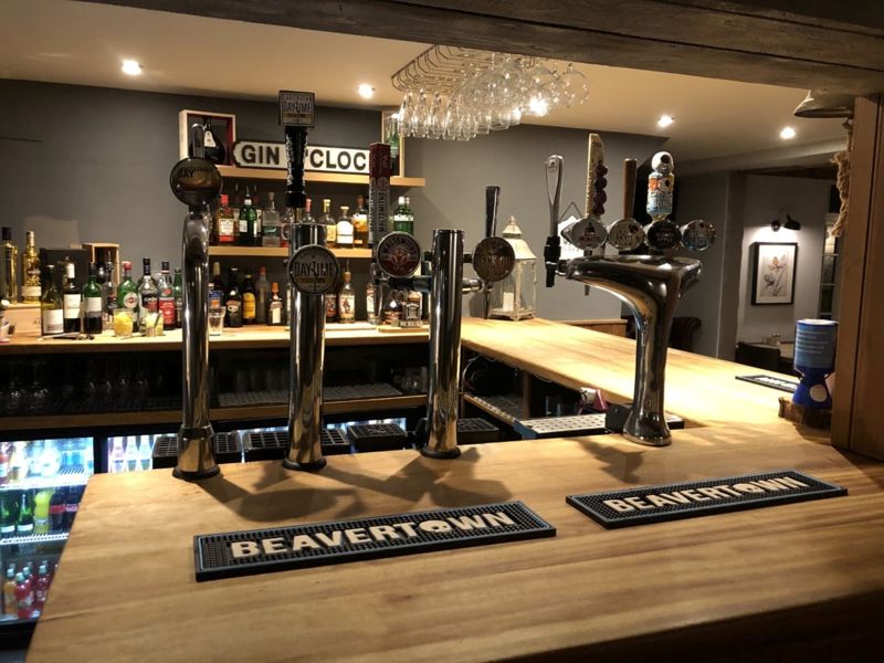 Bar area showing a variety of beer pumps & spirits