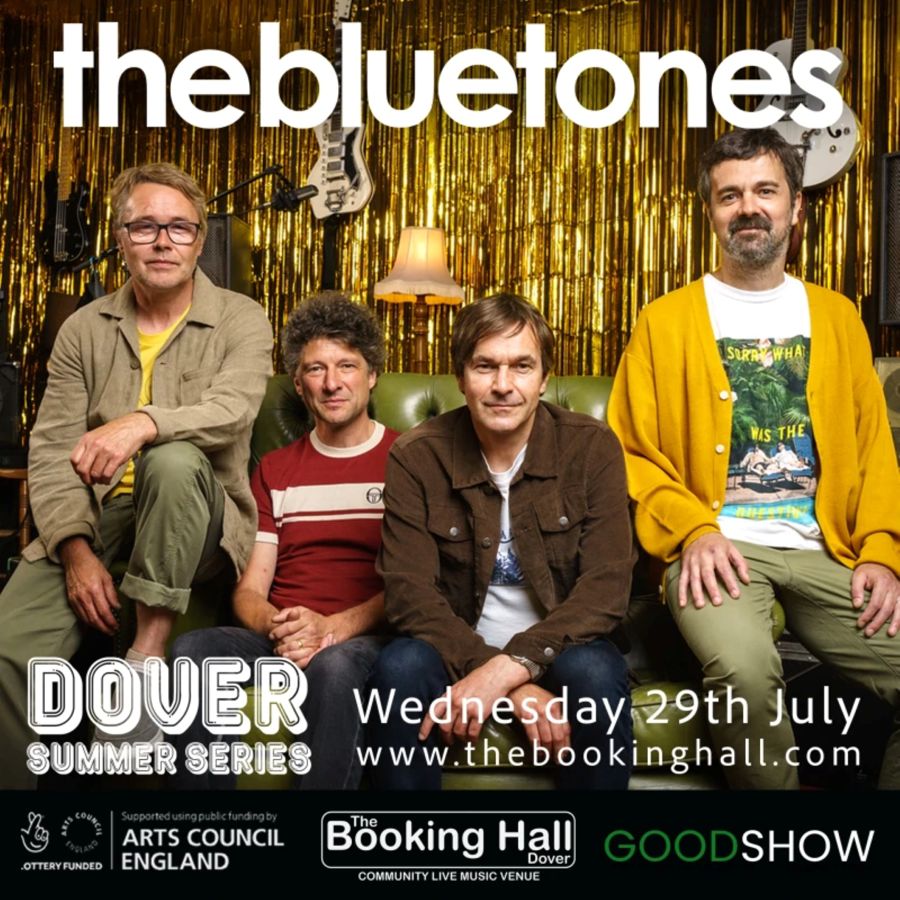 Four men sat on a green leather sofa, The Bluetones music group.