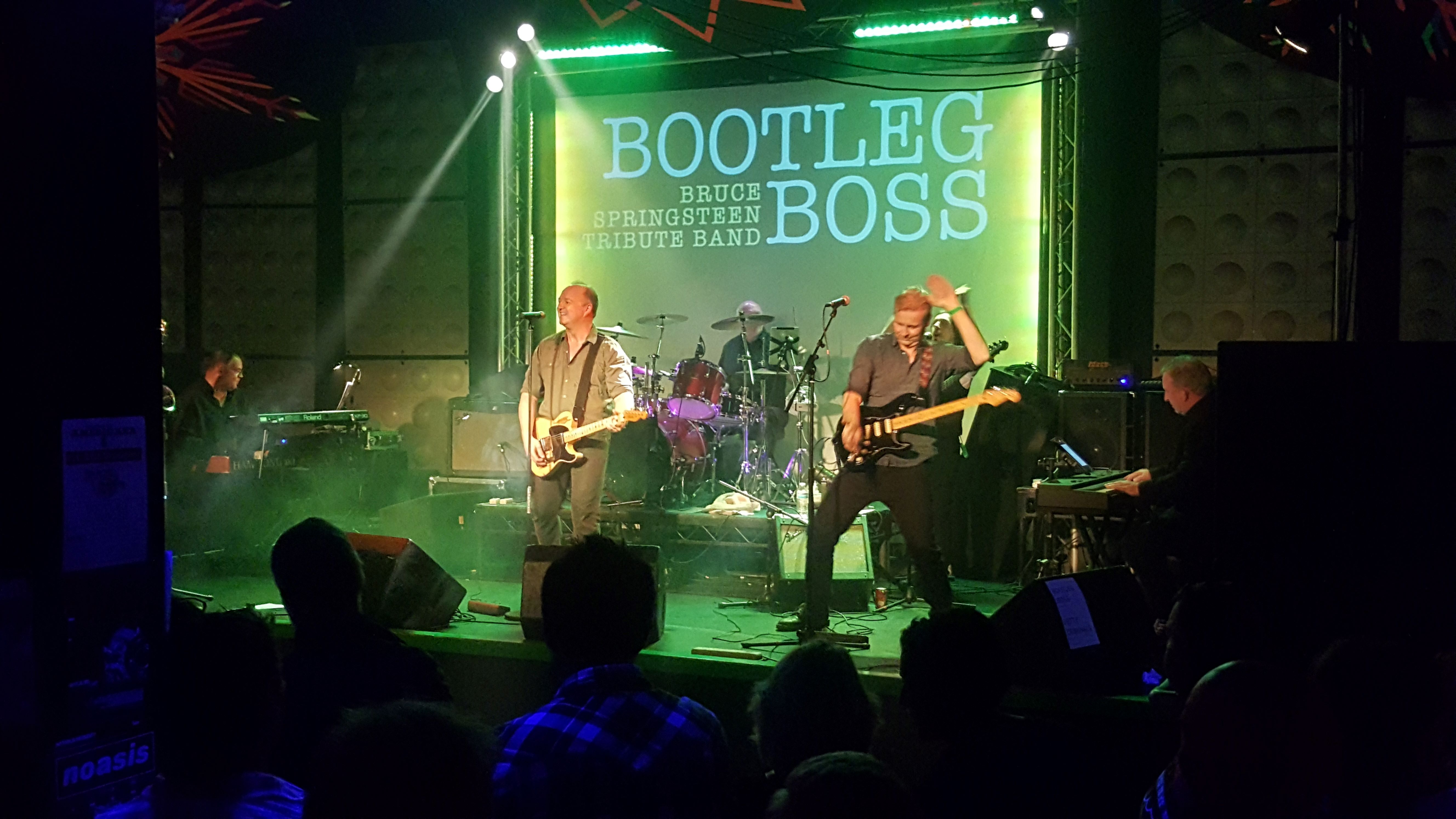 Band members on stage performing