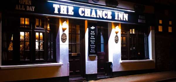 A night time photo of the entrance to The Chance Inn