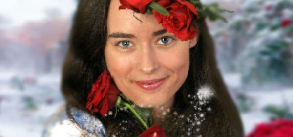 Image of actress playing the character Belle adorned with red roses
