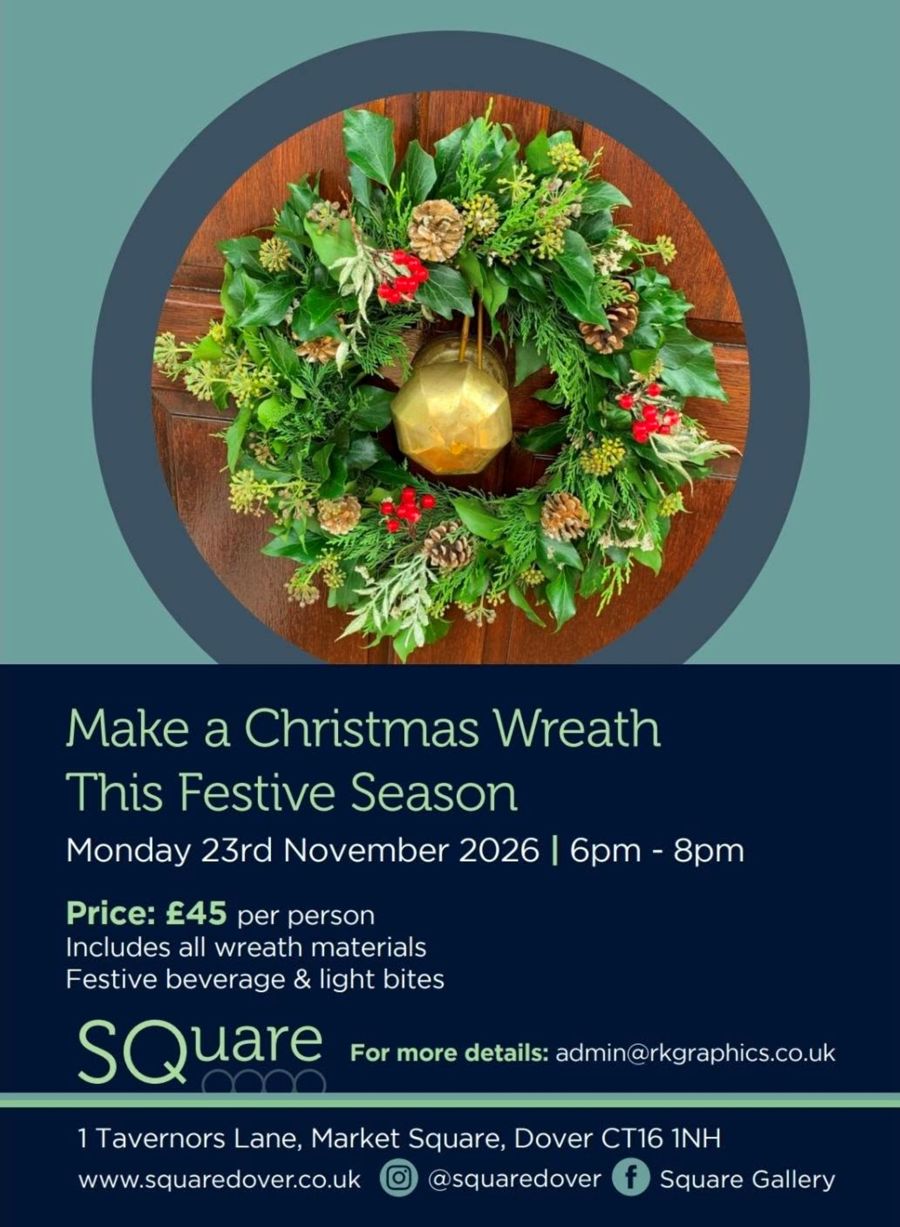 A Christmas Wreath hanging on a door with a gold door knob
