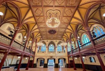 Interior of Connaught Hall with chandeliers and gothic arches 