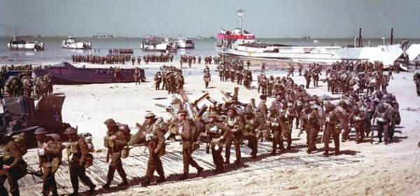 Image of soldiers dis-embarking ships onto the beach for the D Day landings