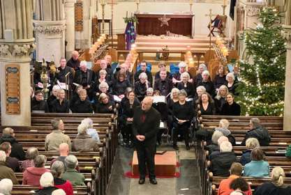 A choir in front of church pews