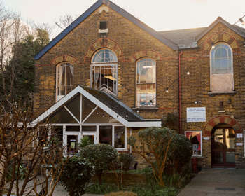 A brick building with arched windows