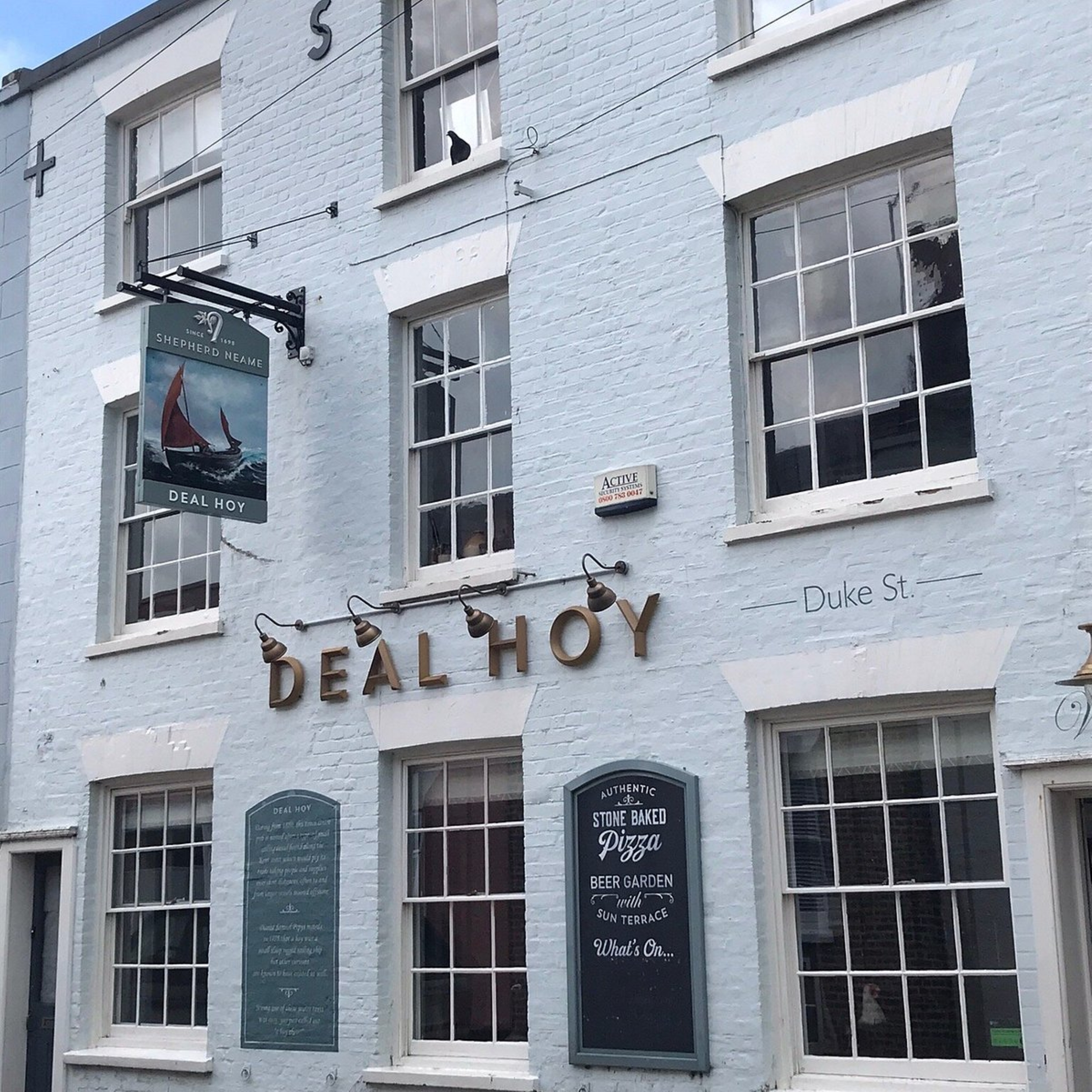 Blue painted front of the Deal Hoy pub