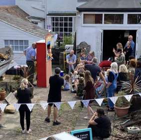 Audience watching a Punch & Judy show.