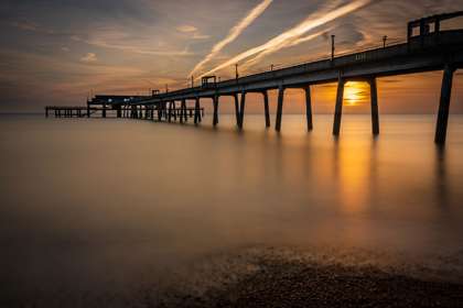 View of Deal Pier from beach at sunset