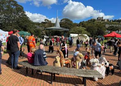 Image of people in Pencester Gardens during a fete.