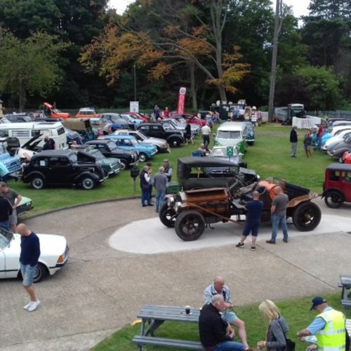 Image of classic cars on display in the grounds of the museum