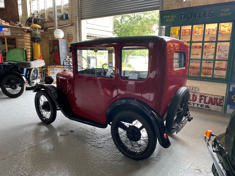 Image of classic red car on display at the museum
