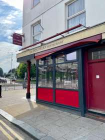 Exterior of The Dovorian with their red & cream paintwork