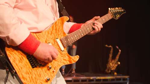 Close up of a guitar being played