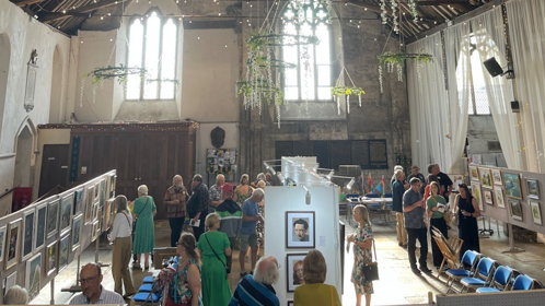 A former church with an exhibition of paintings