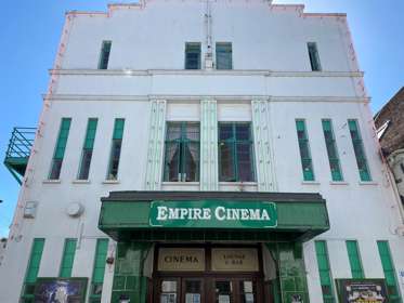 The white and green art-deco exterior of the Empire Cinema in Sandwich.