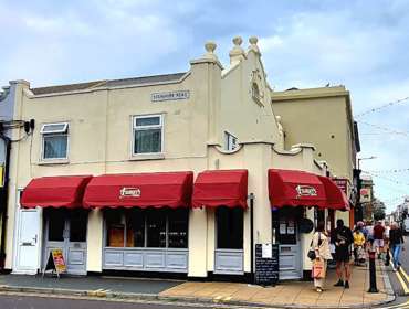 Exterior view of Filberts Foods with red awnings