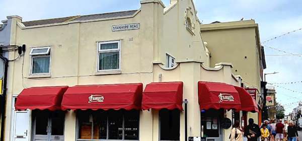 Exterior view of Filberts Foods with red awnings
