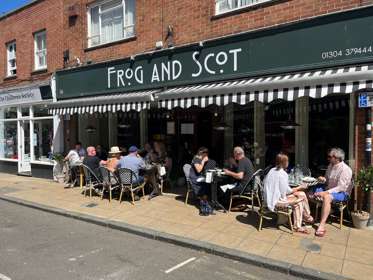 Customers sitting eating and drinking outside The Frog and Scot