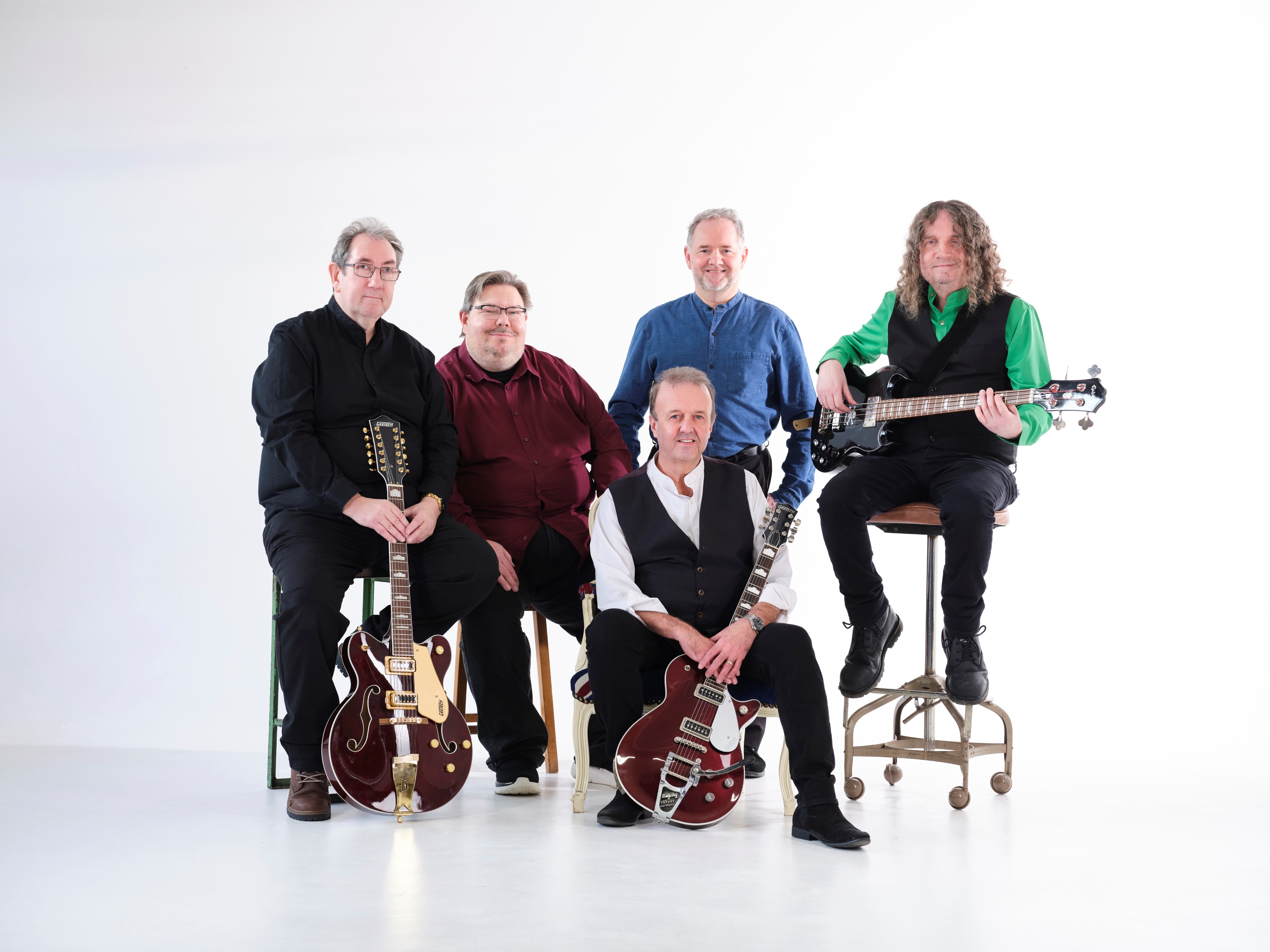 The band members with their guitars