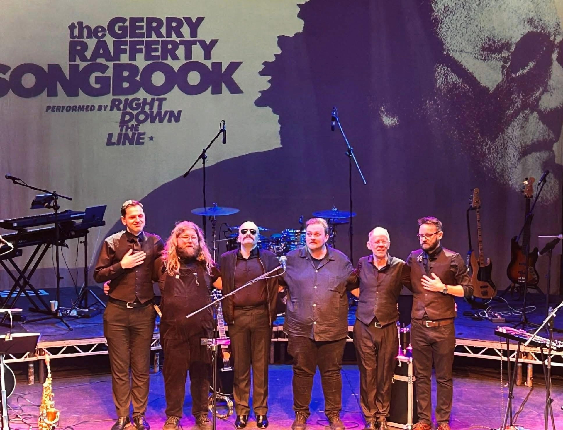 Members of the band lined up on stage