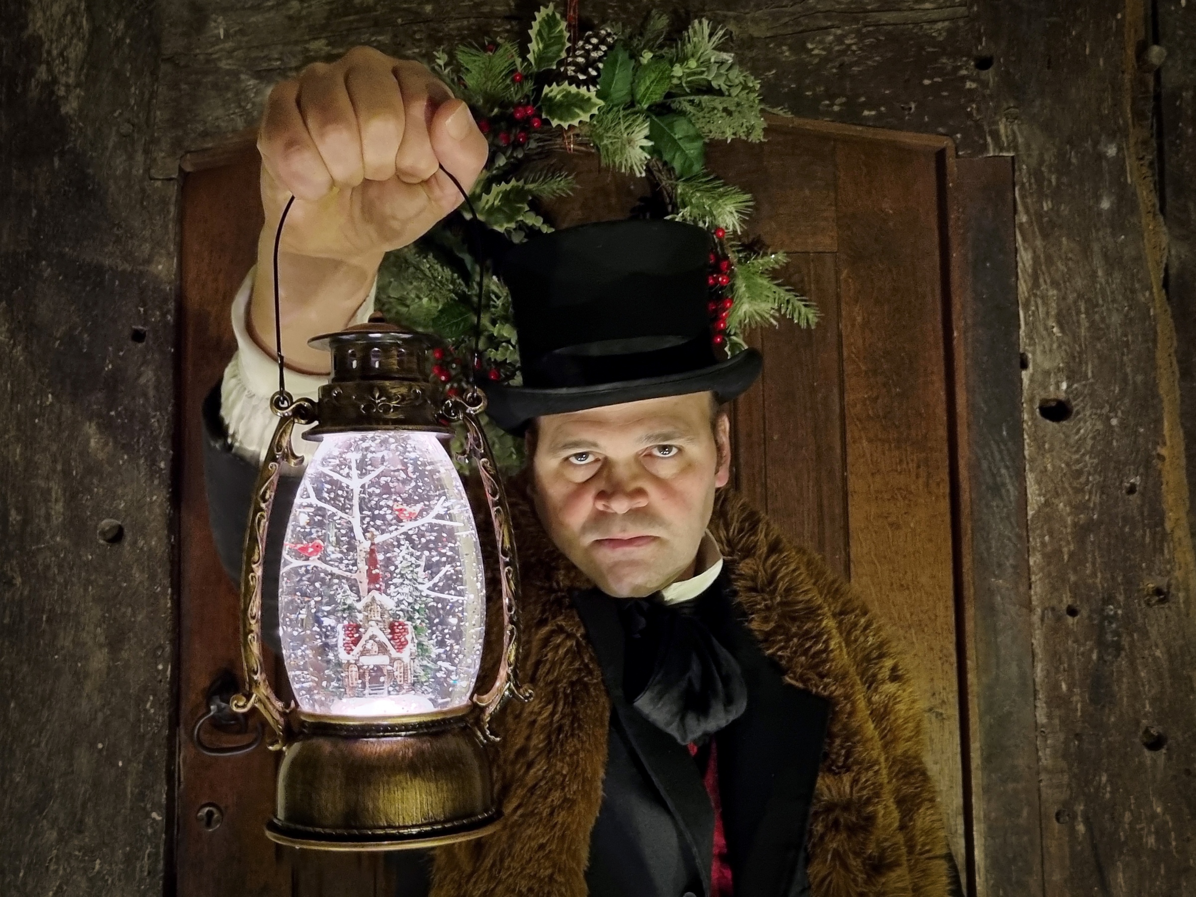 Edwardian dressed man holding a lantern