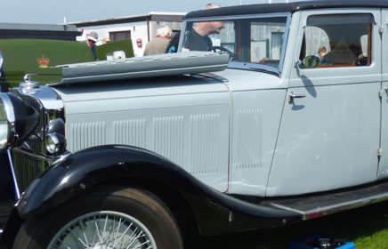 Classic grey car with bonnet folded open