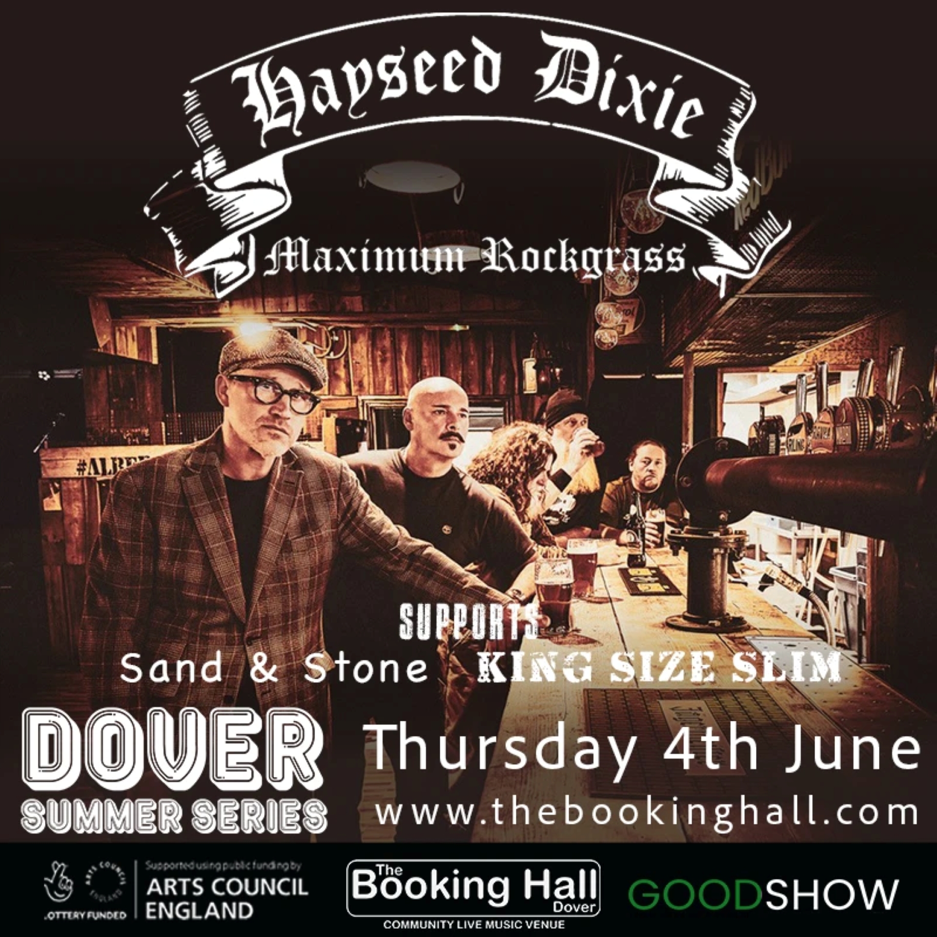 Men standing drinking at a wooden bar