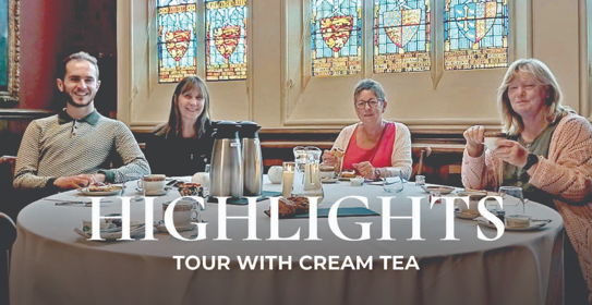 Four people sat at a table with tea