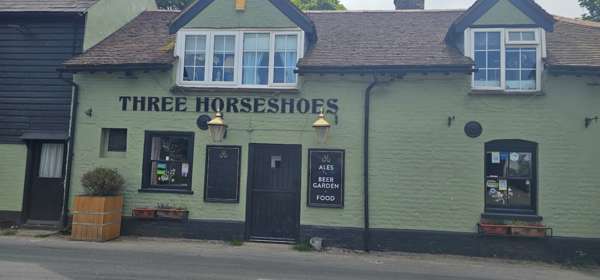 The exterior of the green Three Horseshoes