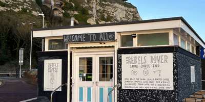 The exterior of Rebels Dover, a cafe and sauna, with the White Cliffs behind.