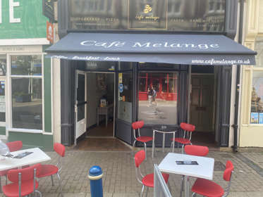 Tables and chairs outside Café Melange  