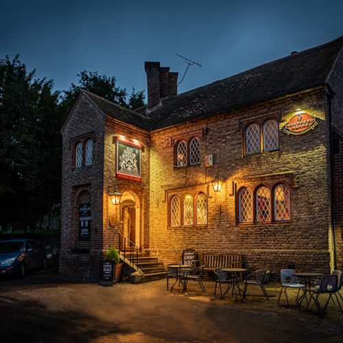 Exterior of Fitzwalter Arms lit up at night