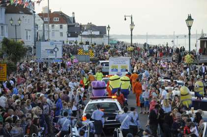Crowds lining the streets at Deal seafront watching the carnival parade