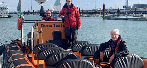 Paul O'Grady sitting in a boat in Dover Harbour