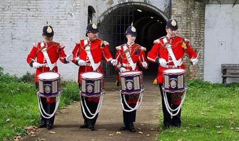 Four drummers from the QRA Corps of Drums outside the Grand Shaft, Dover